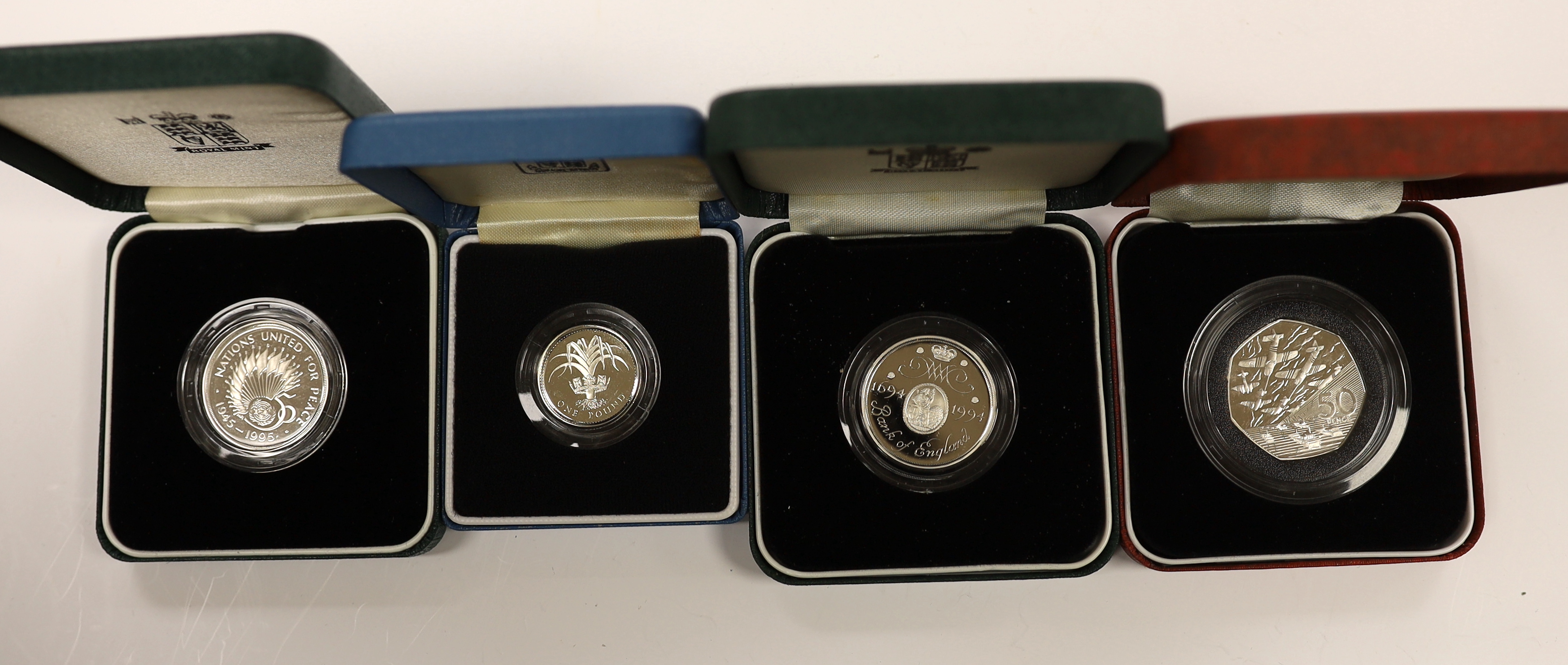 A collection of Royal Mint, Westminster mint and MDM QEII Commonwealth proof silver Royal family commemorative coins, and nine cased Royal Mint silver proof c.1992-95, in four large cases